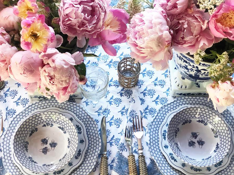 Setting a table with melamine and peonies